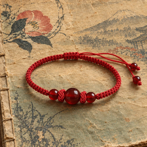 AKA crimson bracelet on antique Japanese paper